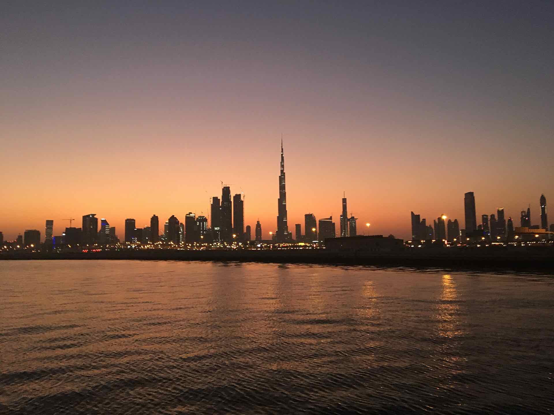 Business Bay and Downtown Dubai skyline at sunset, setting of Atelier by Ellington