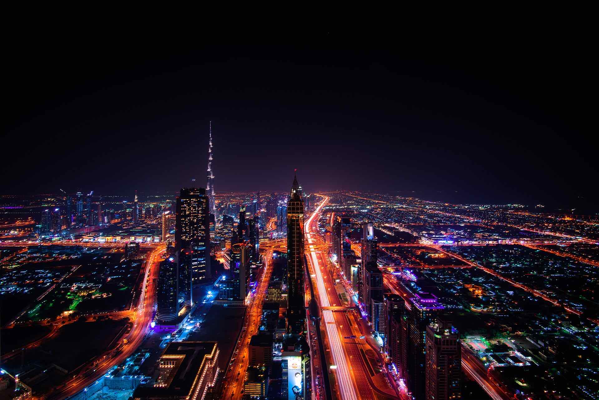 Aerial night view of Sheikh Zayed Road and Downtown Dubai near Business Bay